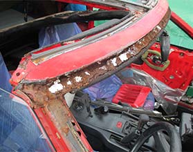 Toyota MR2 with heavy rust damage to 'T' bar roof