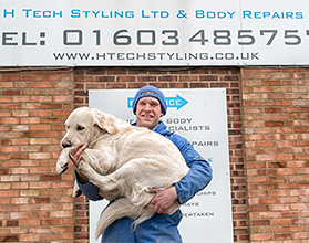 Chris Howlett with pet golden retriever Wilson
